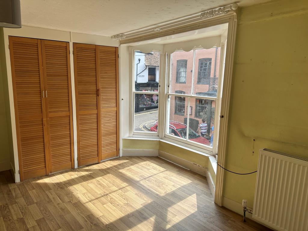 Lot: 9 - FORMER CAFÉ AND CARE FACILITY IN HIGH STREET - Bedroom overlooking High Street